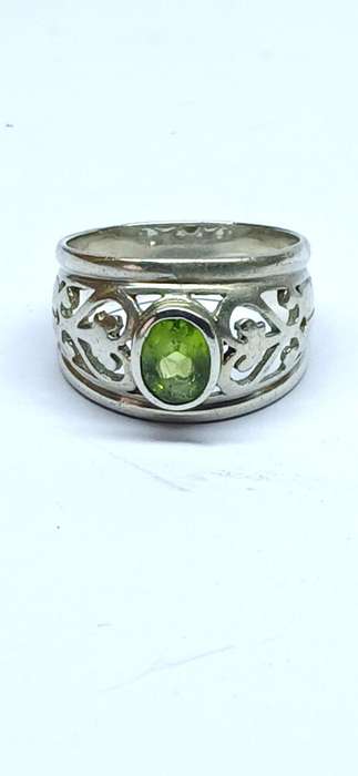 Sterling silver broad ring with green stone