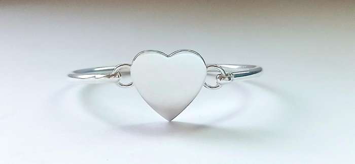 Sterling silver bangle with heart clasp