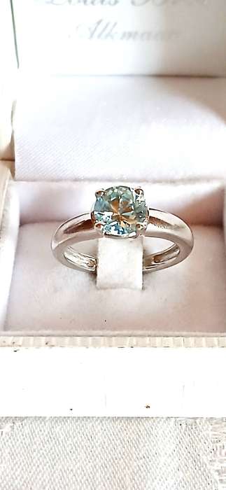 Sterling silver ring with light blue stone
