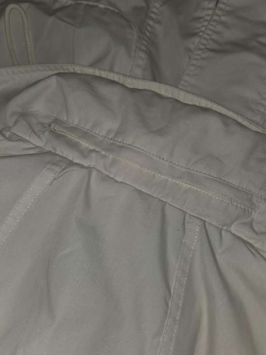 Shelley Jacket with hood that is stored in zipped collar - Size S