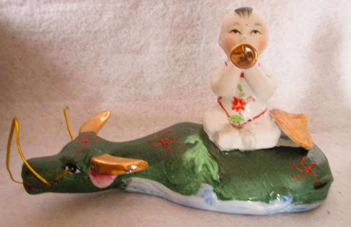 SALE R25 - Two Cute Ceramic Chinese Musical Babies on lying cows Figurenes. 170x100mm
