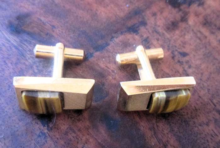 Vintage gold color cufflinks with tiger eye detail.