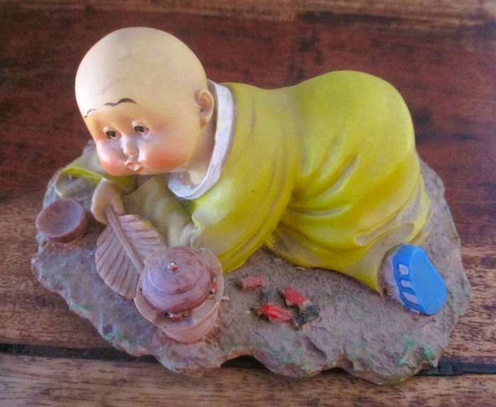 Vintage Shaolin Baby Monk Resin Figurene making a fire. Very Collectable. 140x100mm