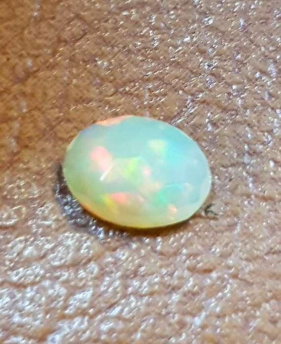 Opal 0.52Cts Oval Facetted 5x7mm Multi Colours Glittering Rainbow 3D! Ethiopian Natural