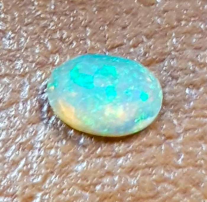 Opal 0.68Cts Oval Facetted 5x7mm Multi Colours Glittering Rainbow 3D! Ethiopian Natural