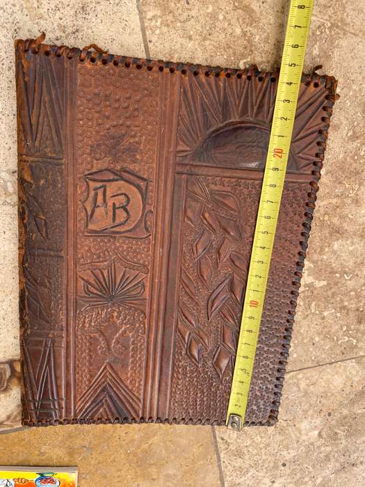 Vintage leather journal cover with prescription notes and envelopes