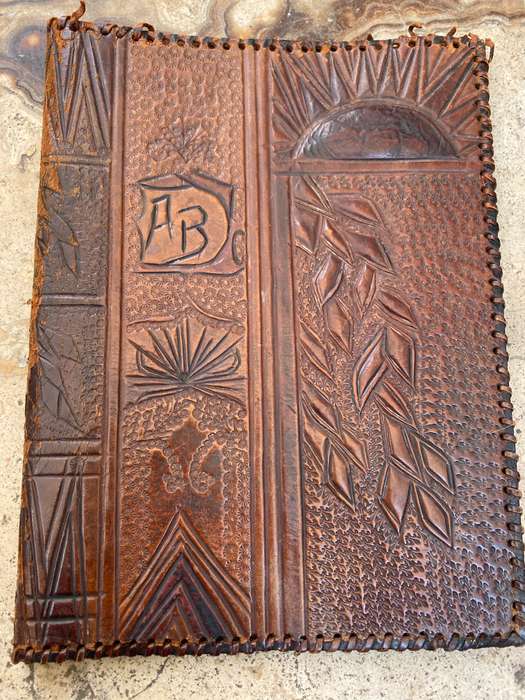 Vintage leather journal cover with prescription notes and envelopes