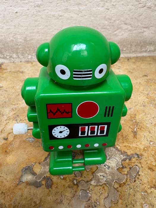 Retro tin Schylling Rowley wind up tin robot , pvc green wind up robot pair