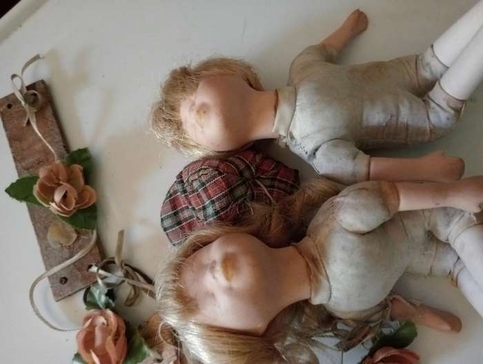 2 SMALL ANTIQUE BABY DOLLS ON SWING