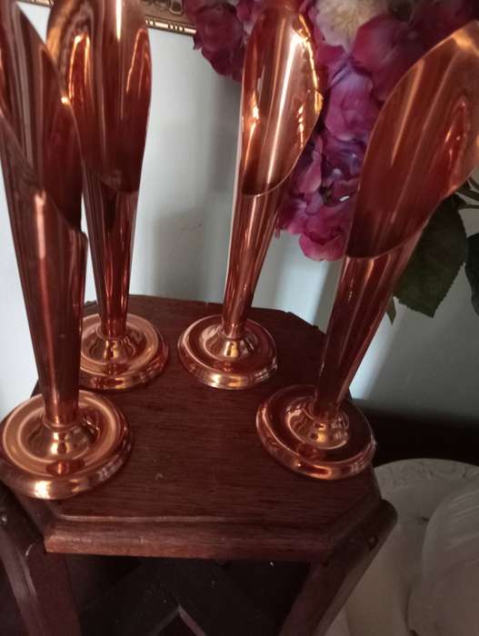 4 COPPER CANDLEHOLDERS
