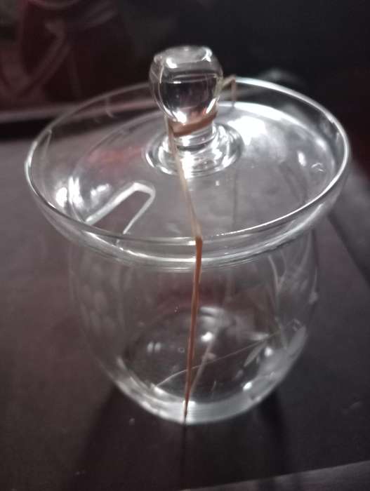 Vintage small glass bottle with lid