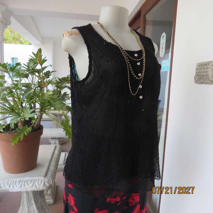 Black sleeveless 2 layer top size 36 with top layer in textured stretch sequined mesh.