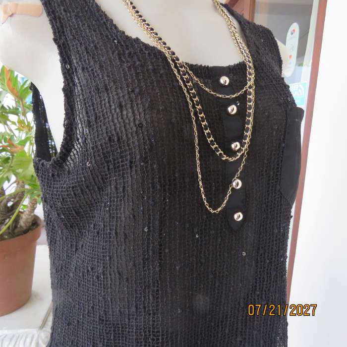 Black sleeveless 2 layer top size 36 with top layer in textured stretch sequined mesh.