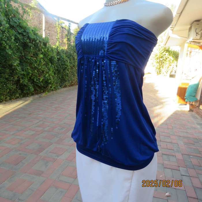 Luxury strapless evening top in royal blue stretch polyester. Sequin decorated. Size 34. As new.
