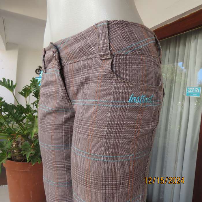 Tartan check bootcut woven poly/rayon pants. Autumn colours. Turnovers. Pockets.Size 34 by INSTINCT.