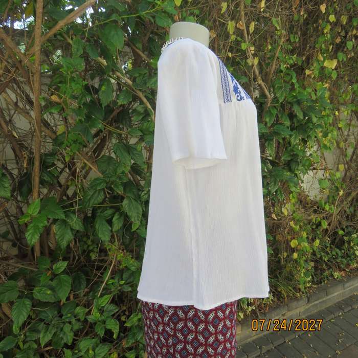White creased cotton slip over short sleeve top. Blue embroidered front yoke. Size 36