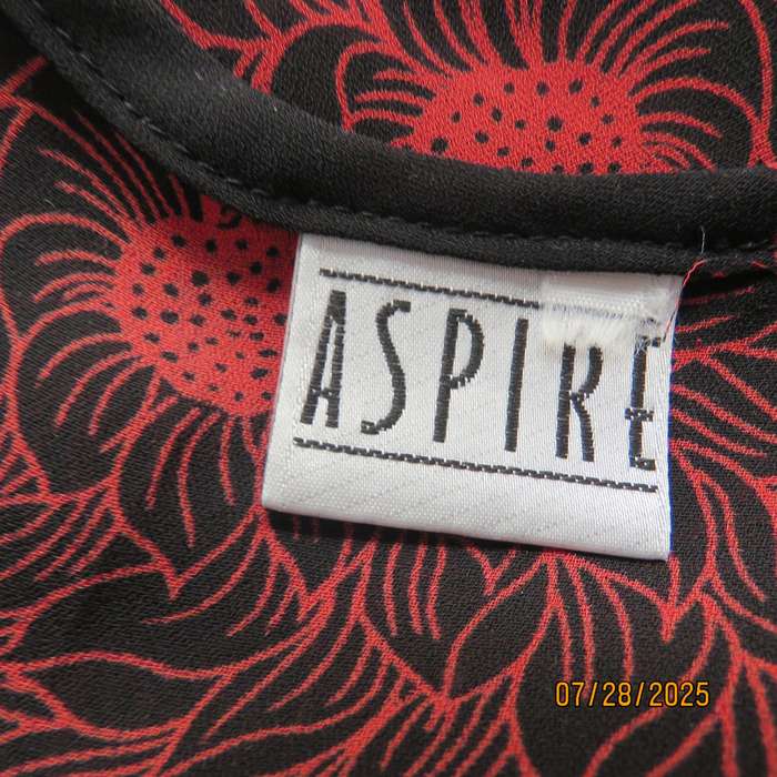 ASPIRE black polyester with red-white bold floral pattern. Unique sleeves. Size 36
