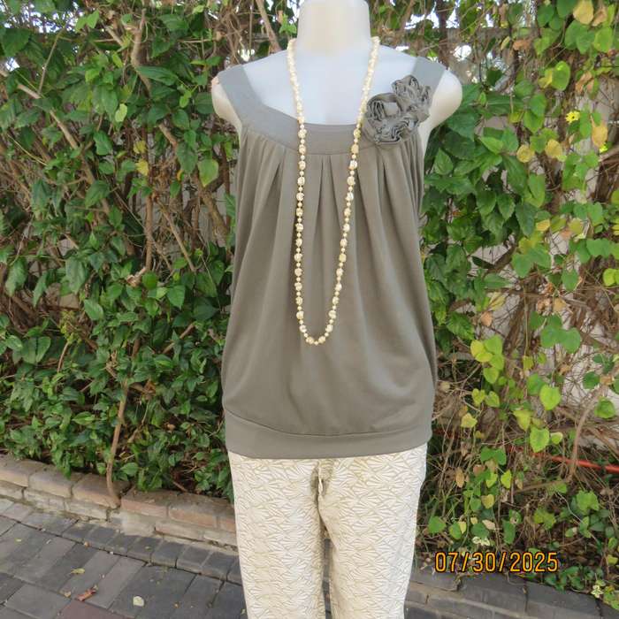 Olive green poly-viscose slip over top with scooped neckline. Pleats on front. Size 38