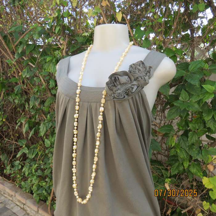 Olive green poly-viscose slip over top with scooped neckline. Pleats on front. Size 38