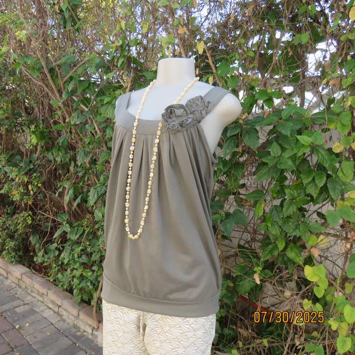 Olive green poly-viscose slip over top with scooped neckline. Pleats on front. Size 38