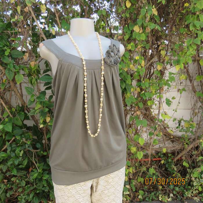 Olive green poly-viscose slip over top with scooped neckline. Pleats on front. Size 38