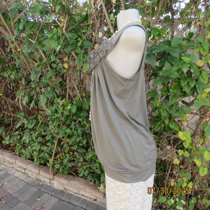 Olive green poly-viscose slip over top with scooped neckline. Pleats on front. Size 38