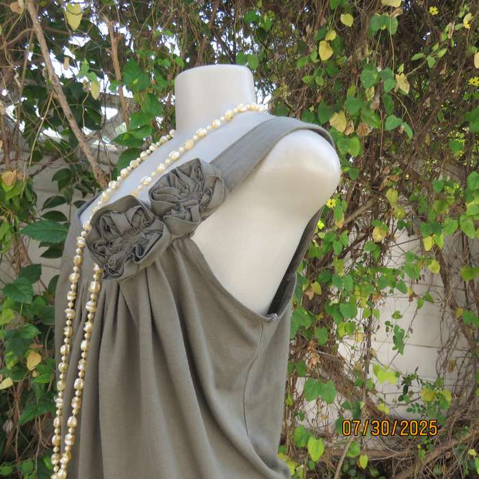 Olive green poly-viscose slip over top with scooped neckline. Pleats on front. Size 38
