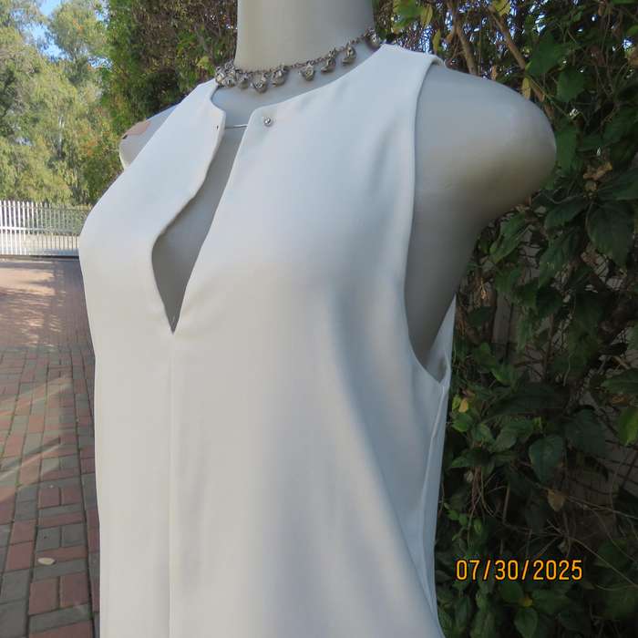 KELSO light cream sleeveless slip over size 34 top. Polyester with lining.
