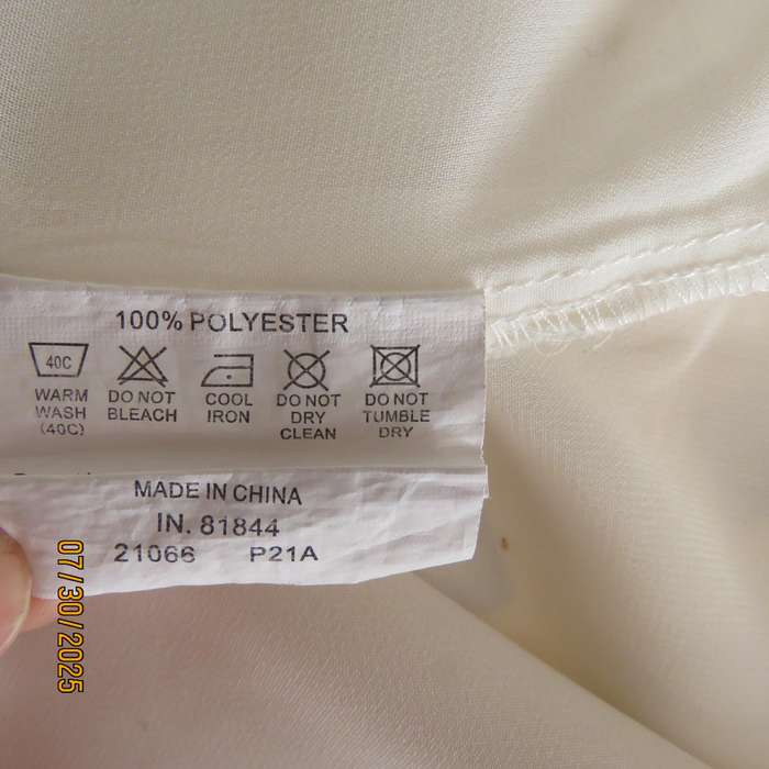 KELSO light cream sleeveless slip over size 34 top. Polyester with lining.