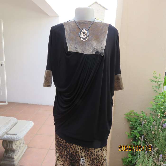 Elegant black stretch polyester long top. Animal print inlays. Size 32 to 34. Pretty off -line pleat