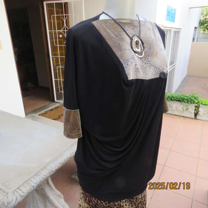Elegant black stretch polyester long top. Animal print inlays. Size 32 to 34. Pretty off -line pleat