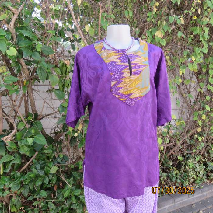 Purple print ethnic short sleeve slip over top with colourful bib. Size 38