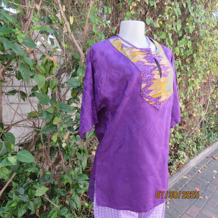 Purple print ethnic short sleeve slip over top with colourful bib. Size 38