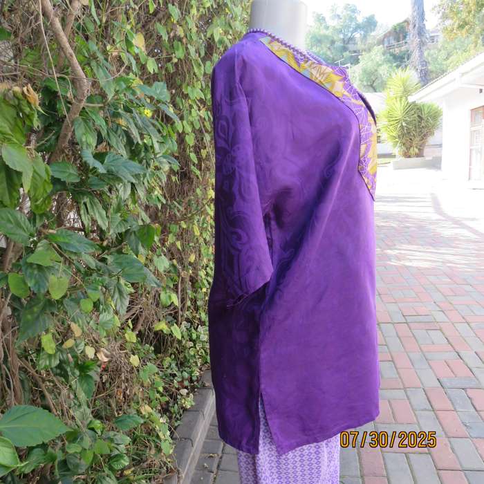 Purple print ethnic short sleeve slip over top with colourful bib. Size 38