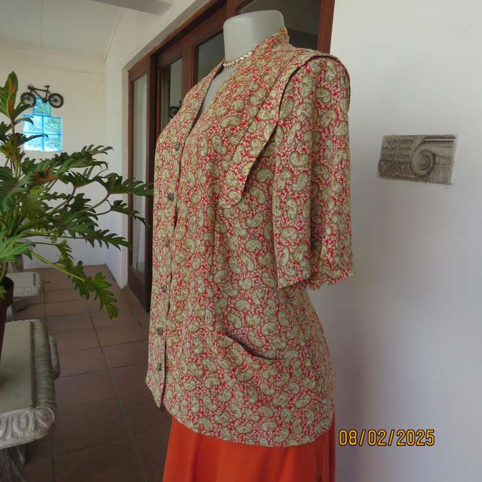 Boutique made silky polyester short sleeve jacket-top. Paisley print. Size 42