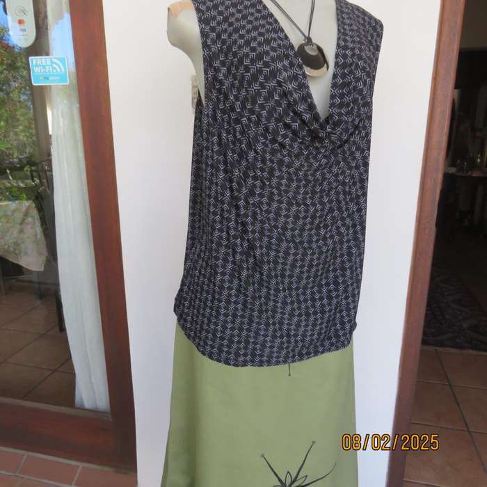Black stretch polyester with tiny graphic print and cowl neckline. Size 42.