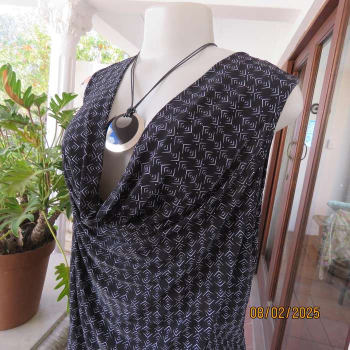 Black stretch polyester with tiny graphic print and cowl neckline. Size 42.