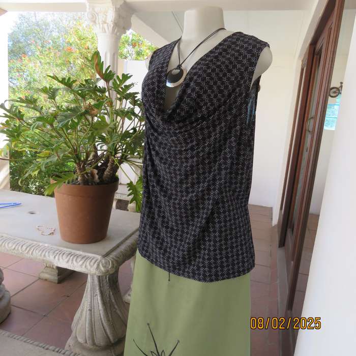 Black stretch polyester with tiny graphic print and cowl neckline. Size 42.