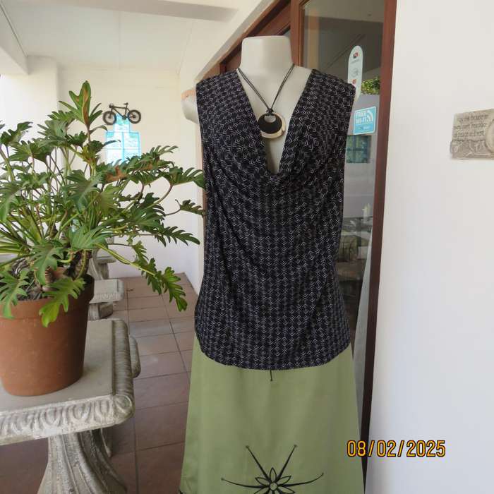 Black stretch polyester with tiny graphic print and cowl neckline. Size 42.