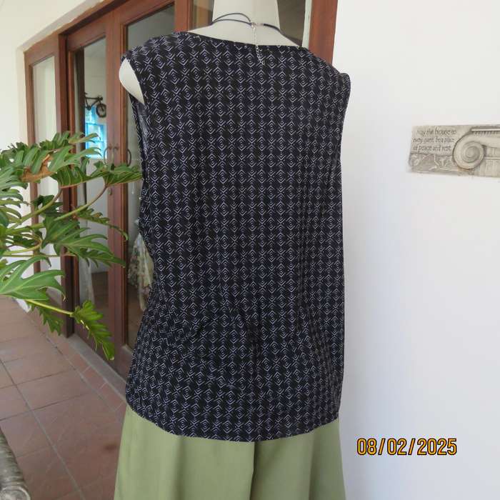 Black stretch polyester with tiny graphic print and cowl neckline. Size 42.