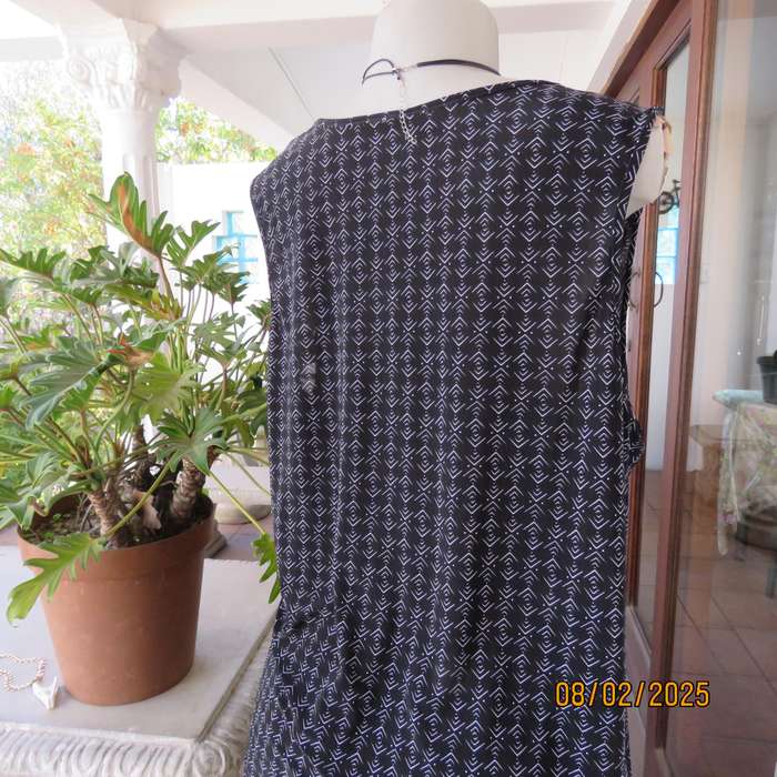 Black stretch polyester with tiny graphic print and cowl neckline. Size 42.
