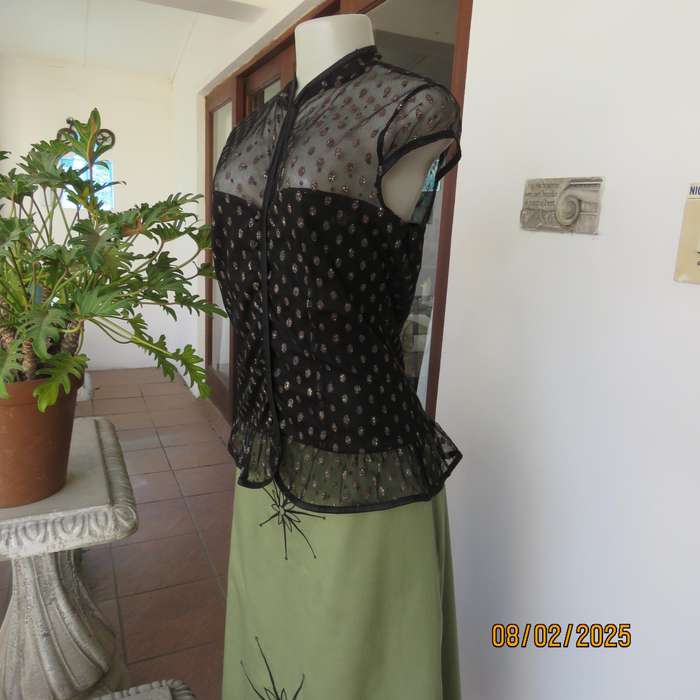WWW black sheer polyester with oval glitter pattern peplum top. Size 36
