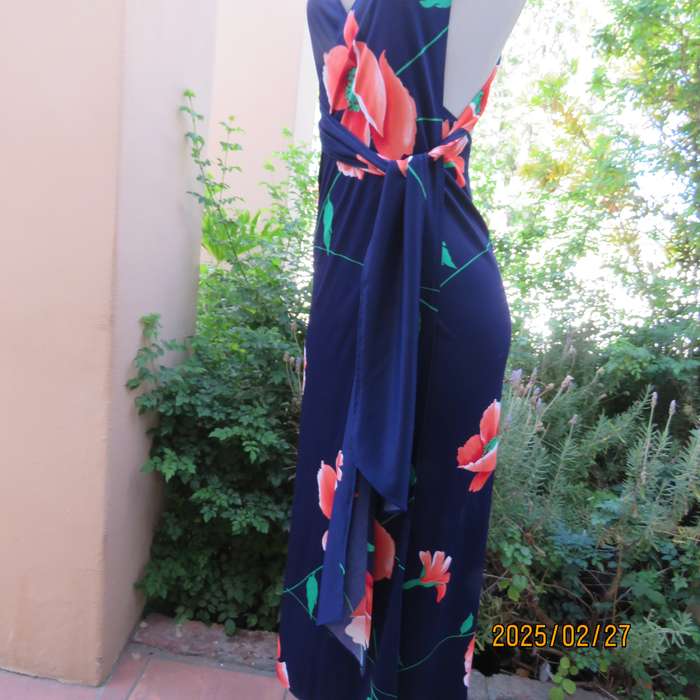 Navy stretch polyester with bold crimson flower pattern tailored fabric with long straps.Size 34-36.