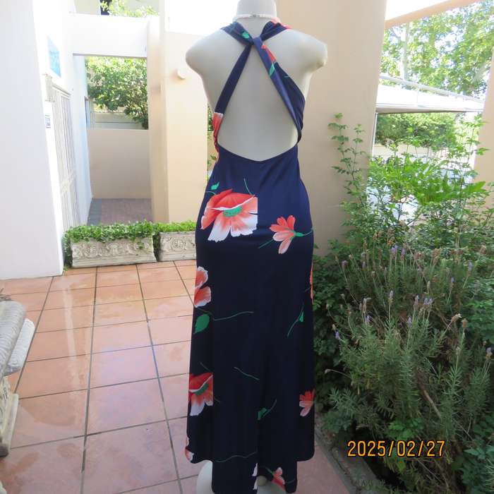 Navy stretch polyester with bold crimson flower pattern tailored fabric with long straps.Size 34-36.