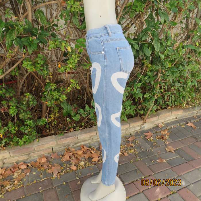 FRG blue polycotton denim jeans with white hearts. Size 34.