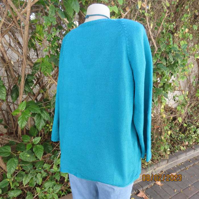 Turquoise handknitted acrylic yarn pull over cardigan with V neck. Size 44-46