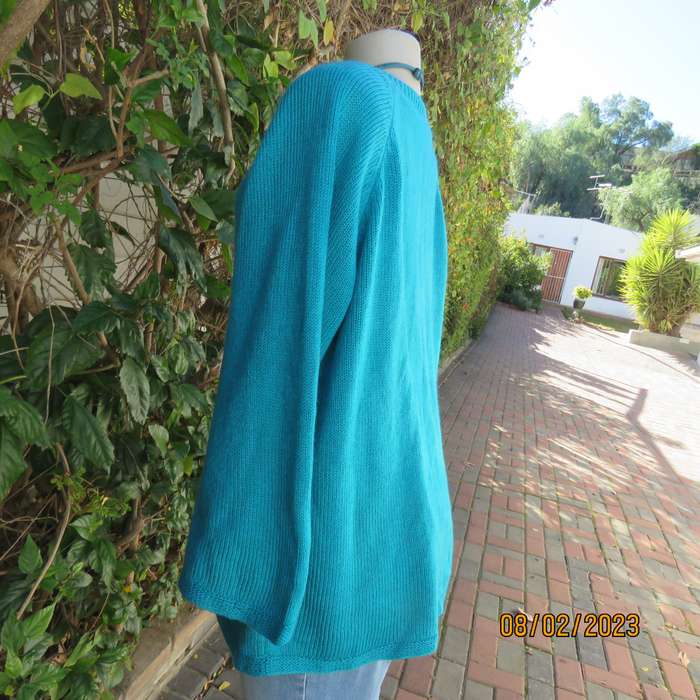 Turquoise handknitted acrylic yarn pull over cardigan with V neck. Size 44-46