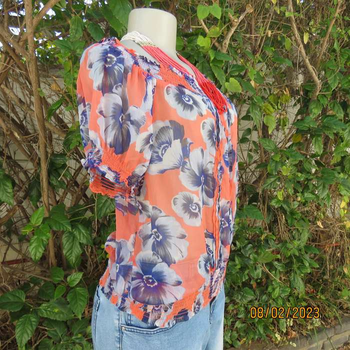 PAPAYA sheer polyester top in salmon with blue flowers. Wide elasticated neckline.Size 38