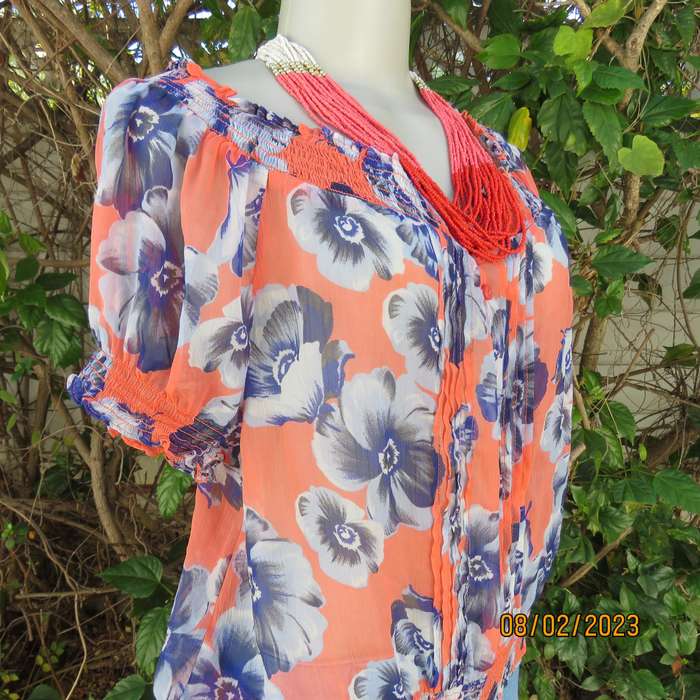 PAPAYA sheer polyester top in salmon with blue flowers. Wide elasticated neckline.Size 38