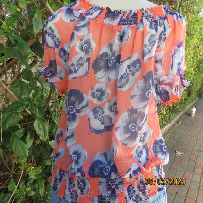 PAPAYA sheer polyester top in salmon with blue flowers. Wide elasticated neckline.Size 38